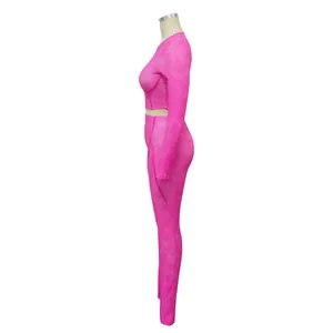 Side view of pink ribbed long sleeve crop top and leggings two-piece sports set