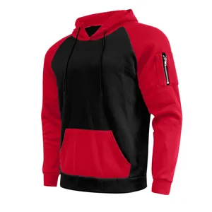 Close-up of men's red and black color-block fleece hoodie featuring a sleeve zipper pocket