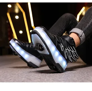 Detailed view of kids black LED roller shoes with white glowing soles and wing design