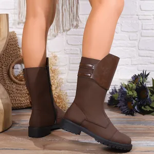 Detail view of brown mid-calf knight boots with side zipper and low block heel.