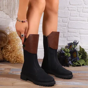 Stylish black women's mid-calf riding boots with side zipper and brown patch detail