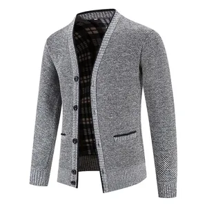 Detailed view of grey men's knitted cardigan with V-neck, button closure and plaid lining