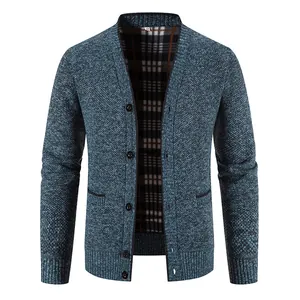 Close-up of men's blue V-neck knit cardigan with plaid lining and textured finish.