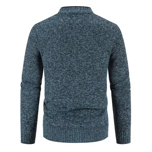 Detailed back view of a thick men's knitted cardigan sweater in dark blue melange