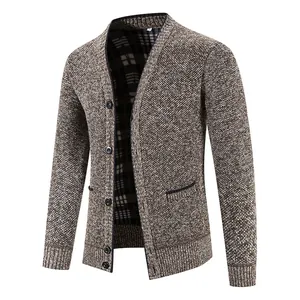 Detailed view of men's brown knit cardigan with V-neck and classic plaid lining.
