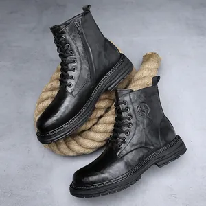 Detailed view of black leather men's Martin boots with side zippers and thick soles