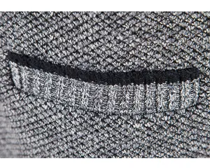Macro detail of men's knitted cardigan jacket showing pocket rim and grey marl texture