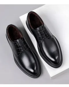 Macro detail view of men's black genuine leather dress shoes with warm fleece lining