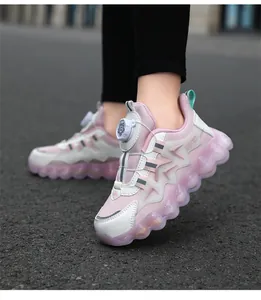 Detailed shot of pink children's sneakers with a rotary buckle system and soft bubble soles