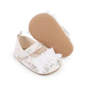 Detail view of baby floral lace walking shoes showing non-slip rubber dot sole
