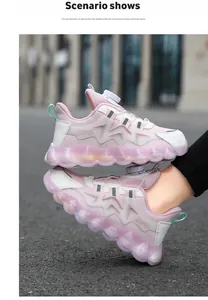 Side view of pink kids' sports shoes featuring a rotary buckle and thick pink sole.