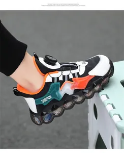 Detail view of kid's sports shoe with a convenient rotary buckle closure.