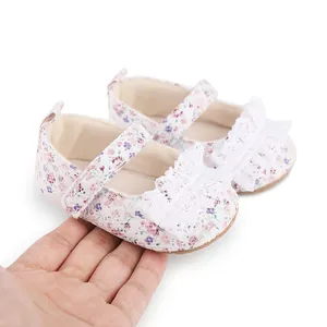 Detailed view of floral pattern baby walking shoes featuring elegant white lace ruffles