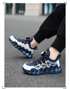 Detail view of kids waterproof sneakers featuring a rotation buckle and blue wavy sole