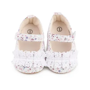 Detailed view of floral baby walking shoes featuring delicate white lace trim accents