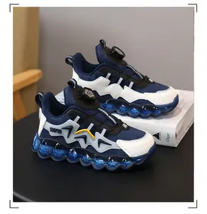 Close-up of children's blue sneakers with rotary buckle and translucent bubbly sole.