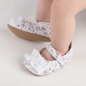 Detailed view of floral lace baby walking shoes featuring a delicate white lace bow