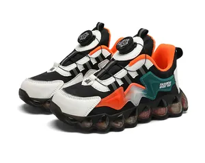 Detailed side view of children's waterproof sports shoes featuring a rotary buckle