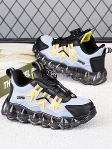 Detail of children's running shoes with rotary buckle and thick bubble sole design