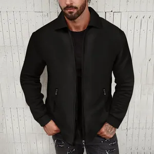Detail of men's black waffle-knit zip jacket with lapel collar and slim fit design