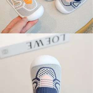Detail of breathable flyknit baby floor shoes with protective soft-sole toe cap.
