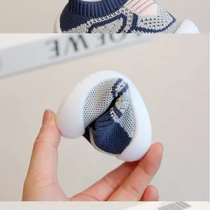 Close-up showing the ultra-flexible sole of a knit baby walking shoe.