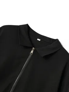 Close-up of black waffle knit texture and zipper detail on a men's lapel cardigan jacket