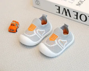 Detailed close-up of grey baby flying-woven walker shoes with anti-slip soft rubber soles