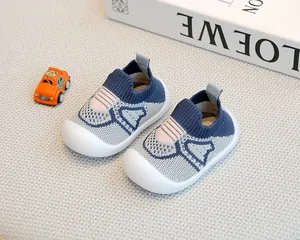 Detailed close-up of breathable knit baby walking shoes with anti-slip soft soles