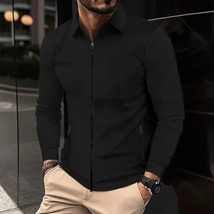 Detail view of men's black waffle knit jacket with lapel collar and full zipper design