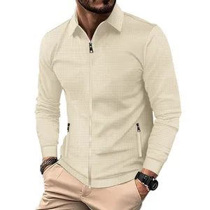 Detail of beige waffle knit long sleeve zip-up jacket with lapel collar