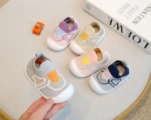 Detailed view of multi-colored breathable knit baby shoes with soft non-slip soles.