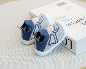 Close-up of breathable blue flyknit baby sock shoes with soft anti-slip rubber soles.