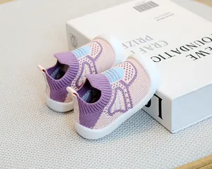 Detailed view of breathable purple fly-knit baby sock shoes with white soft sole
