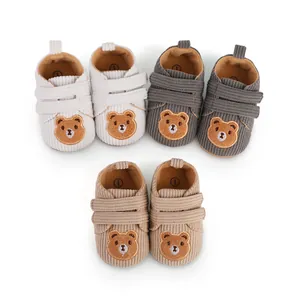 Cozy corduroy baby walking shoes featuring cute teddy bear embroidery for infants