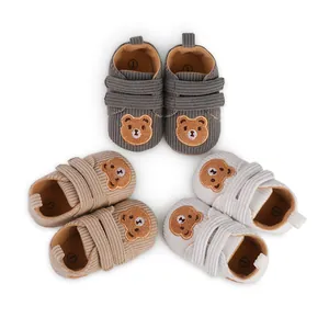 Three pairs of cute bear corduroy baby walking shoes for 0-1 year olds in white background