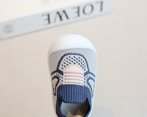 Close-up of breathable knit baby first walker shoes with non-slip soft sole