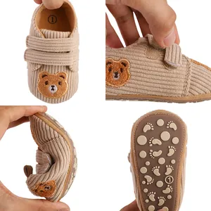 Soft corduroy baby walking shoes featuring cute bear embroidery and flexible non-slip soles