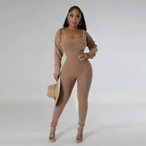 Full detail view of a tan ribbed two-piece jumpsuit set with a matching bolero shrug
