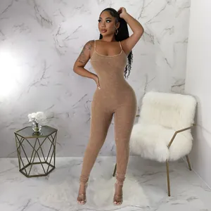Front full view of a sexy camel ribbed bodycon jumpsuit with U-neck and spaghetti straps