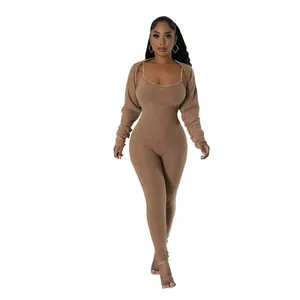 Sexy brown ribbed U-neck jumpsuit set with matching long sleeve shrug shown on model