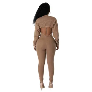 Rear view of a sexy ribbed tan bodycon jumpsuit set featuring backless detail and shrug