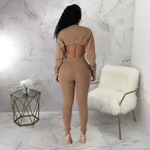 Sexy backless tan ribbed long sleeve jumpsuit for women shown from the back view detail.
