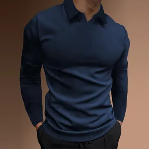 Macro view showing the fine ribbed texture of a navy blue long-sleeved polo shirt for men