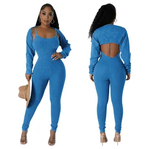 Sexy ribbed blue two-piece jumpsuit set featuring U-neck cami and long sleeve shrug