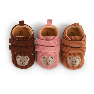 Top view of baby corduroy pre-walker shoes featuring cute embroidered bear faces