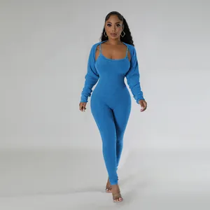 Full length studio view of women's blue ribbed jumpsuit set with matching shrug