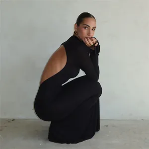Elegant black bodycon maxi dress featuring a dramatic backless design and long sleeves.