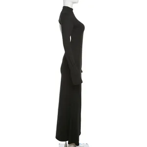 Elegant black long sleeve backless bodycon maxi dress shown from a side profile view