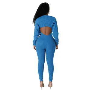 Detailed back view of a sexy blue ribbed bodycon jumpsuit with open back cutout